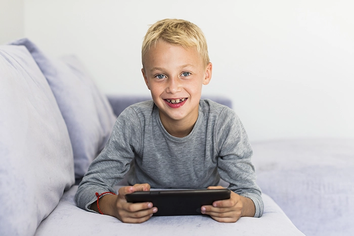 ©little-boy-having-fun-with-tablet-700px